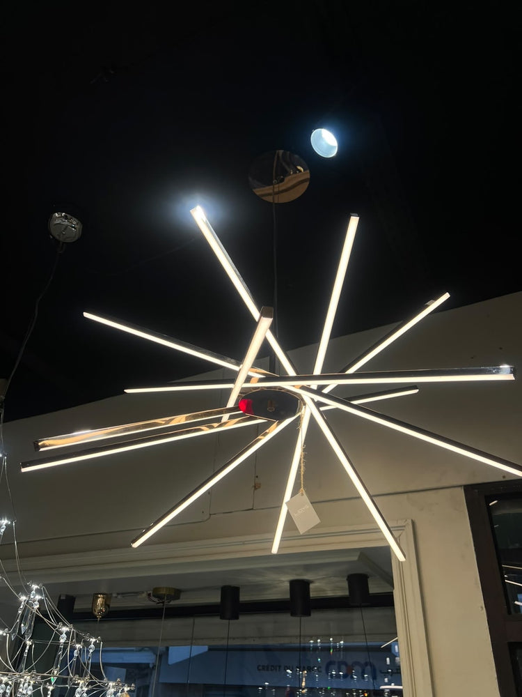 Lustre Raggio — photo réelle au showroom