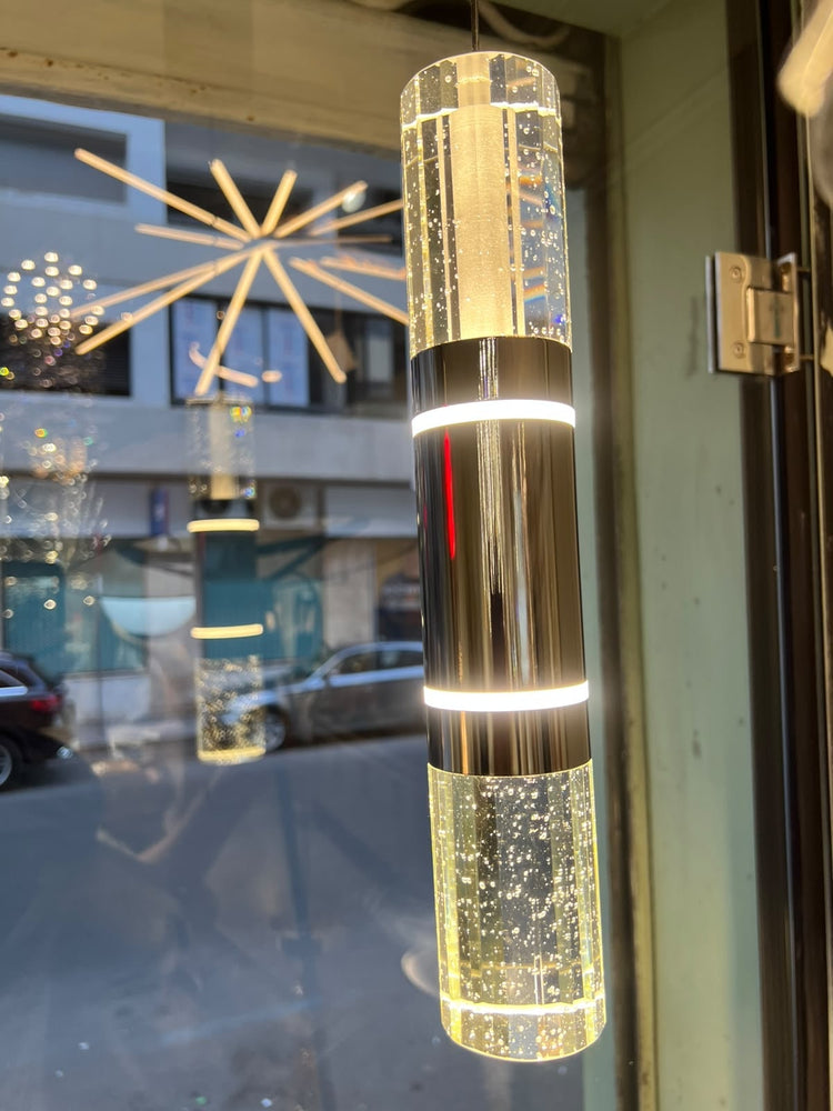 Suspension Colonna — photo réelle au showroom